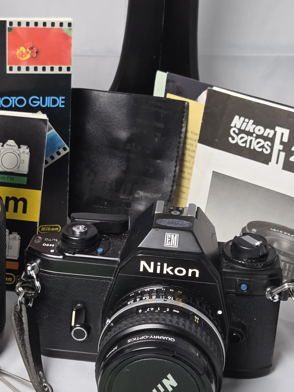 Nikon EM 35mm Film Camera Kit with 28mm, 50mm, 70-210mm Series E Lenses, SB-E Fl